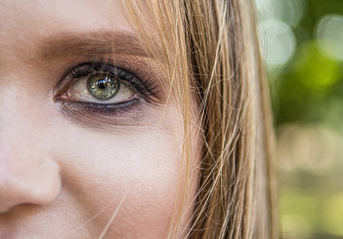persons eye in close up photography