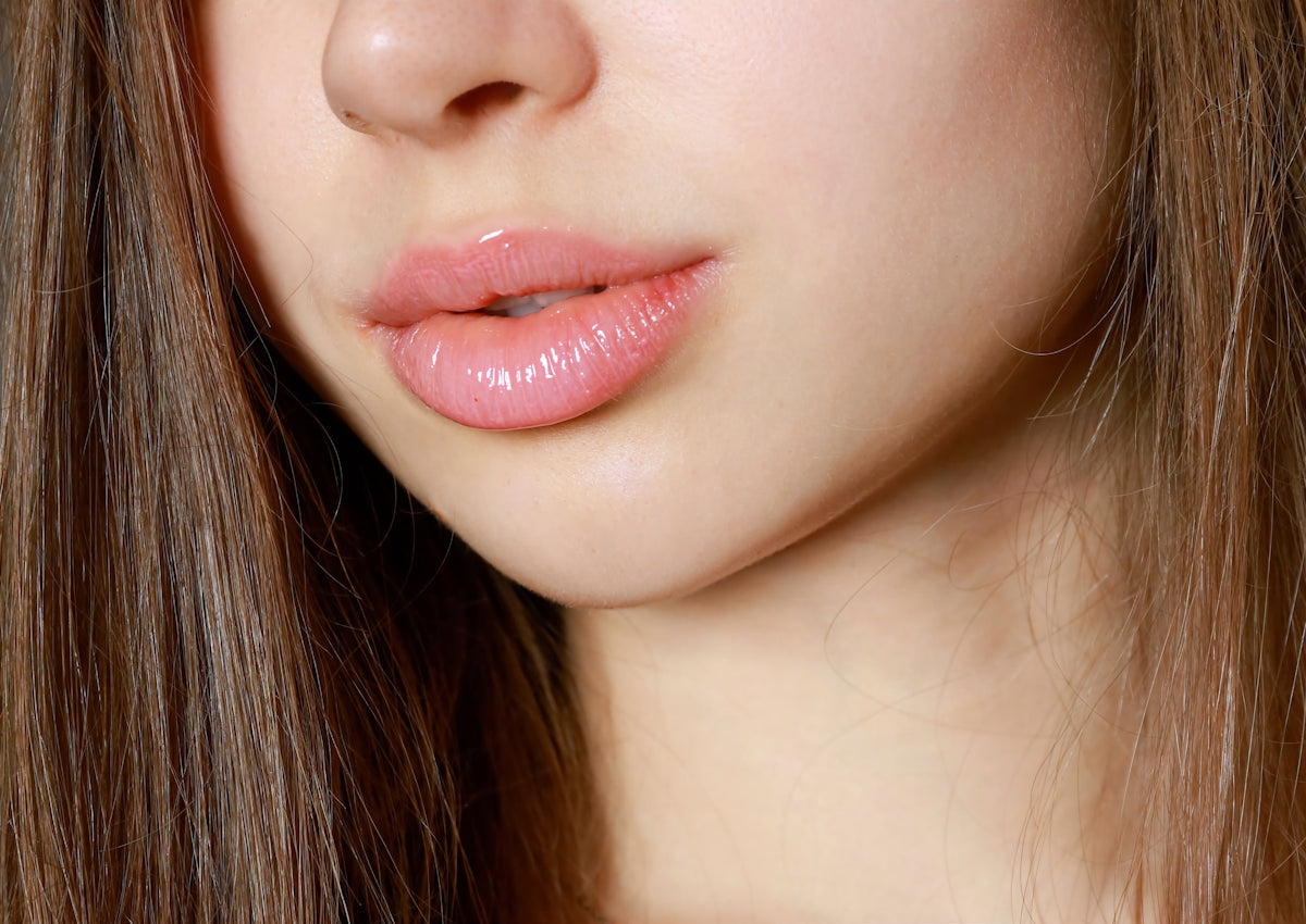 a close up of a woman with long brown hair