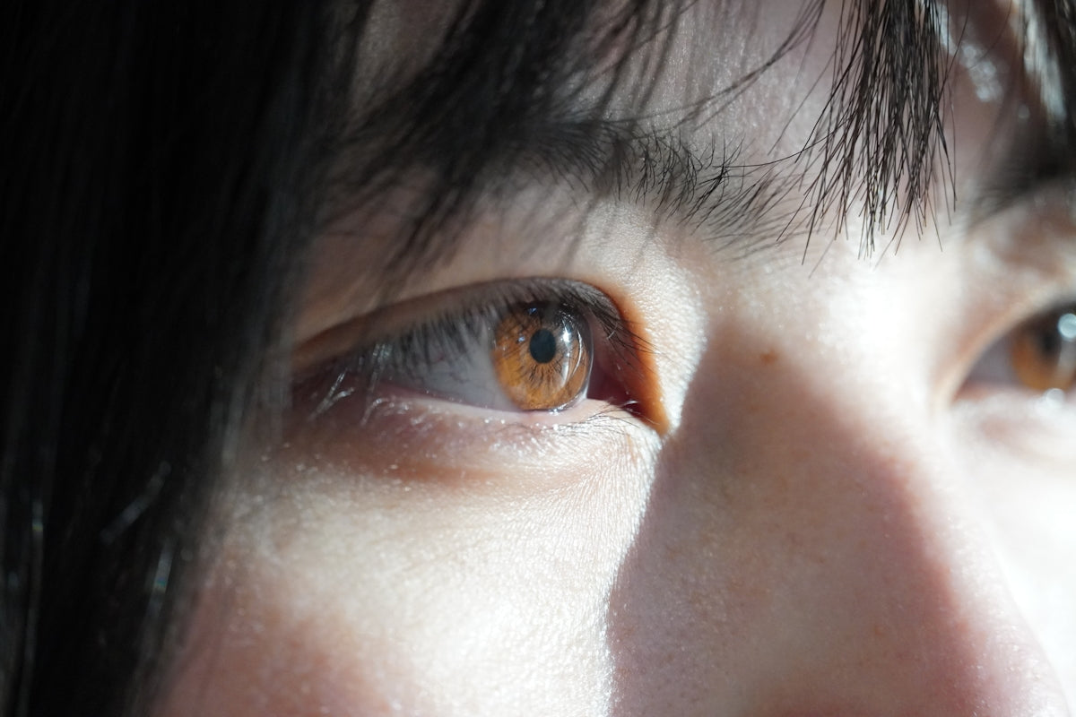 a close up of a person with brown eyes