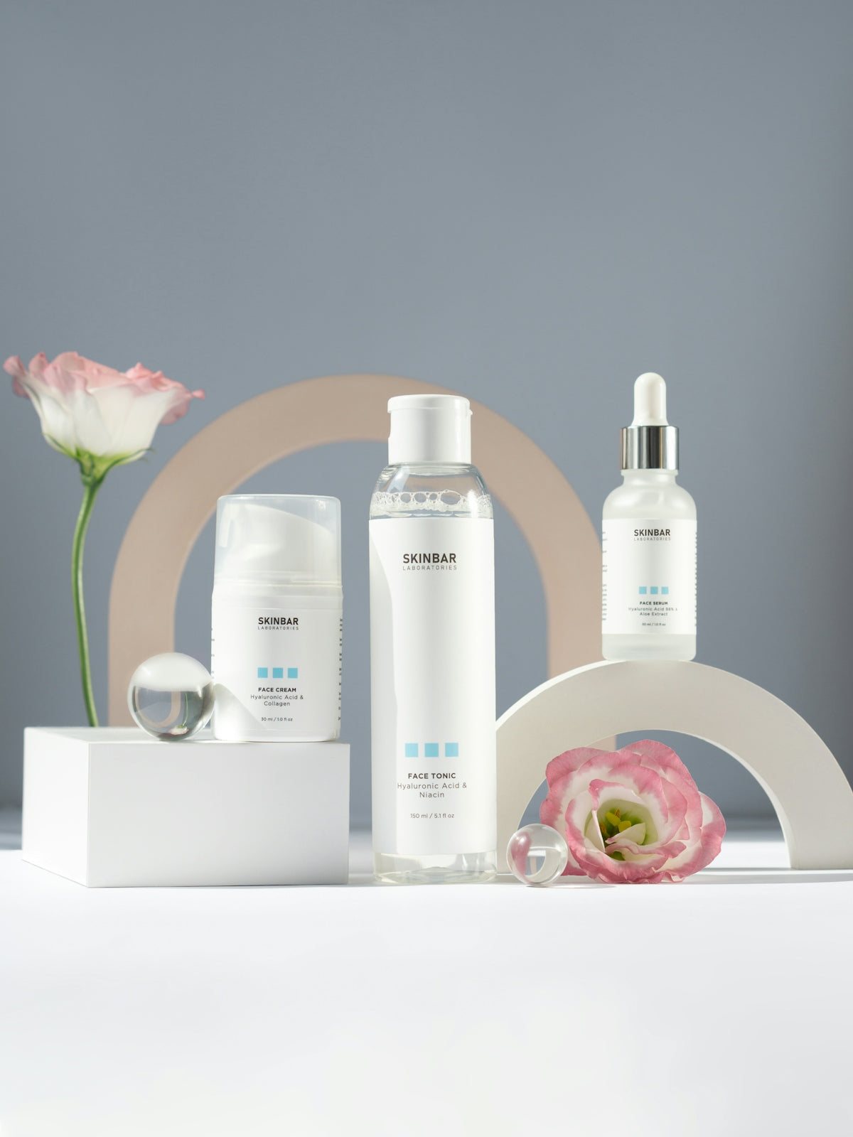 a group of bottles and a flower