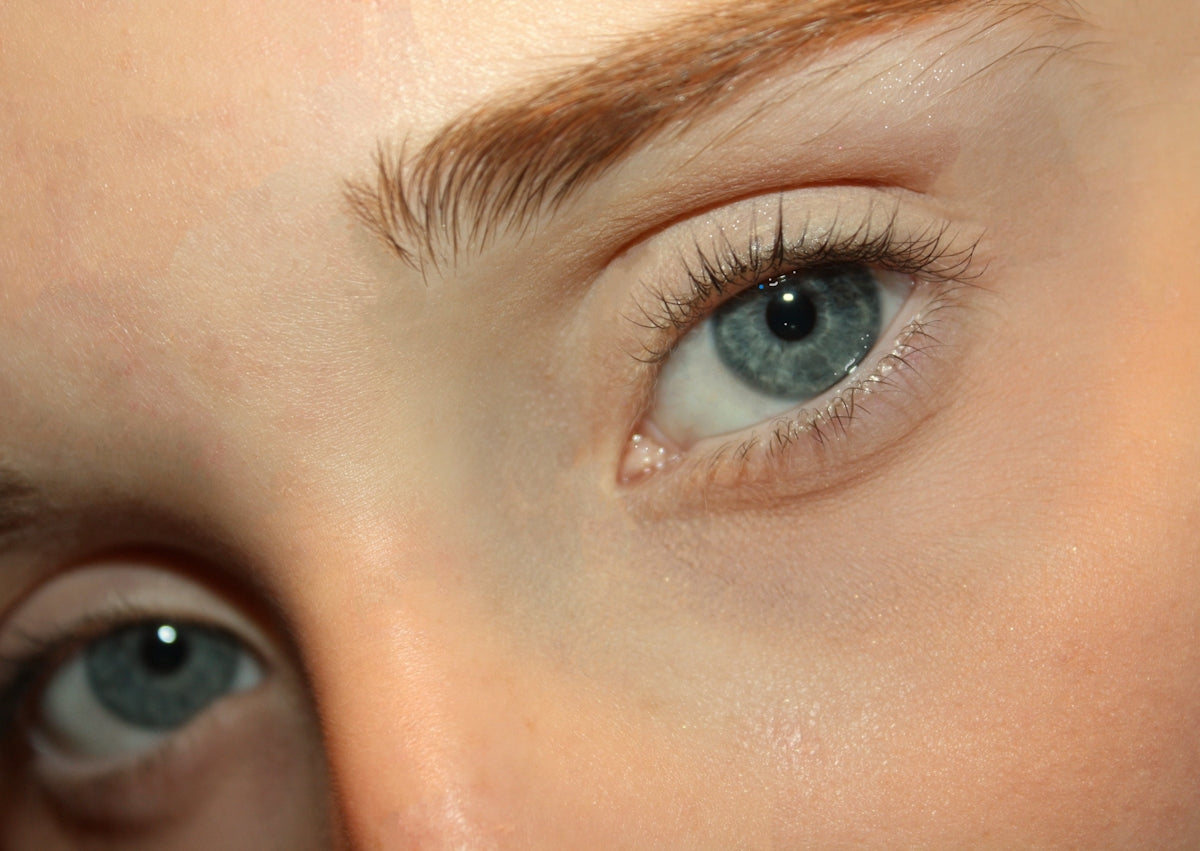 Beautiful blue eyes stare intently at the viewer.