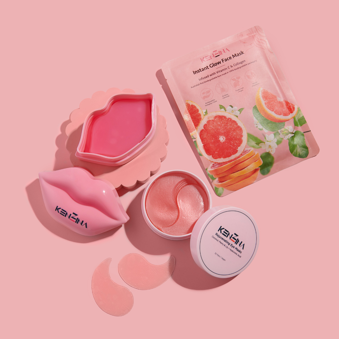 A combination of products from Kenzina, a jar of eye masks, lip masks, and a face mask on a pink background