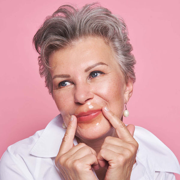 Kenzina Plumping Lip Masks worn by lady on lips. Hydrating, moisturising and anti-aging.