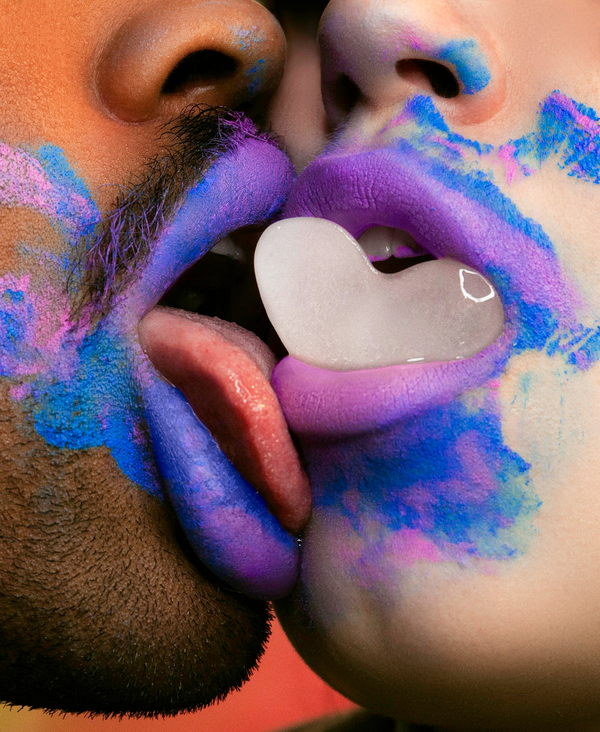 man licking woman's lip