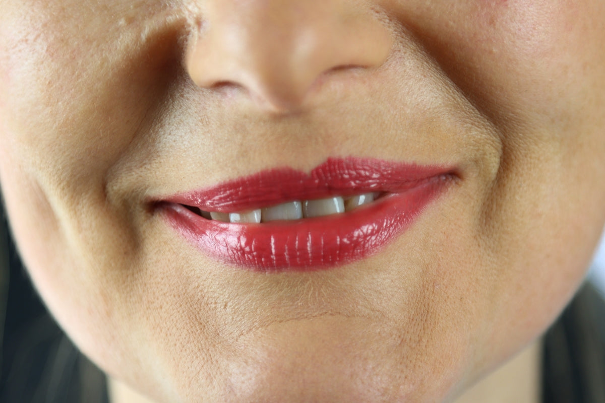 woman with red lipstick and white shirt