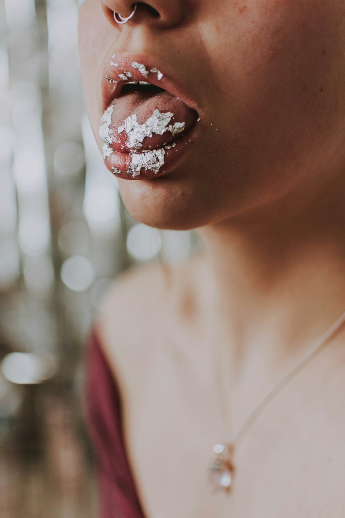 woman with red lipstick and white tank top