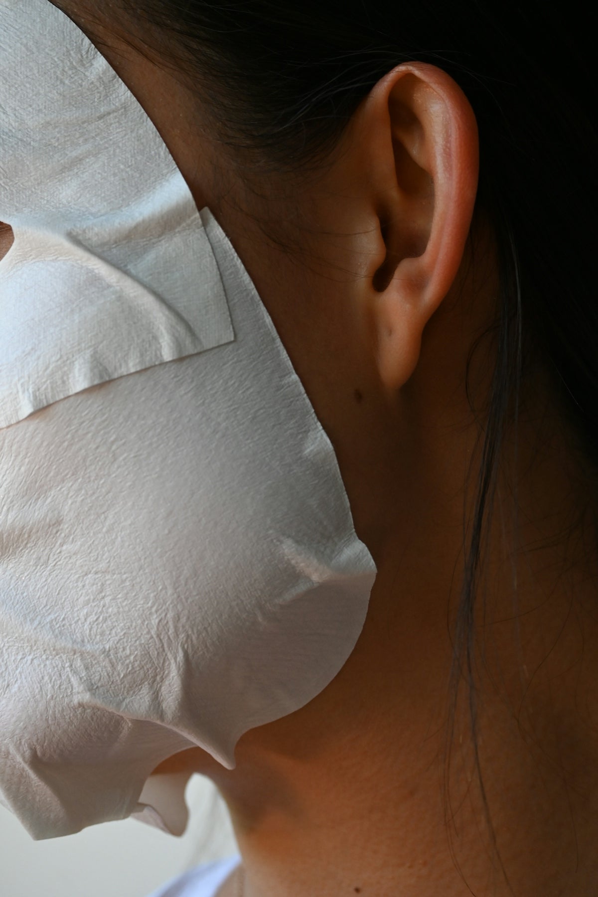 a close up of a person wearing a mask
