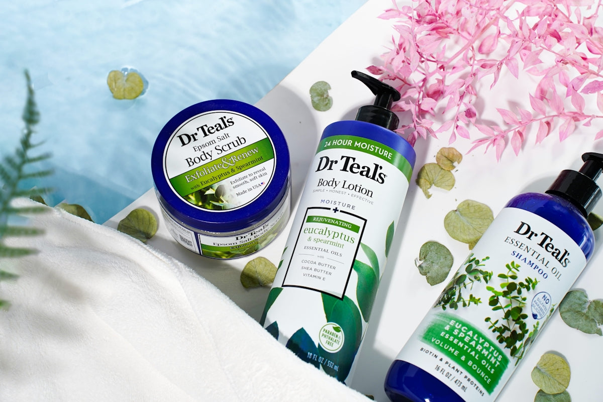 a couple of bottles of lotion sitting on top of a table