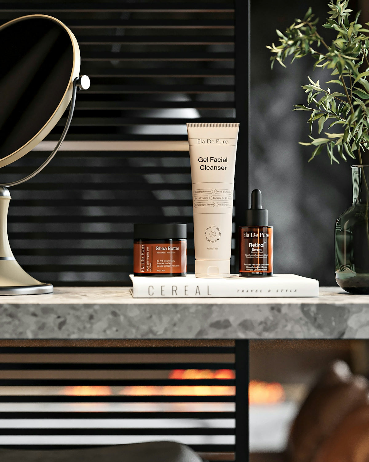 Skincare products, mirror, and plant on a marble counter.