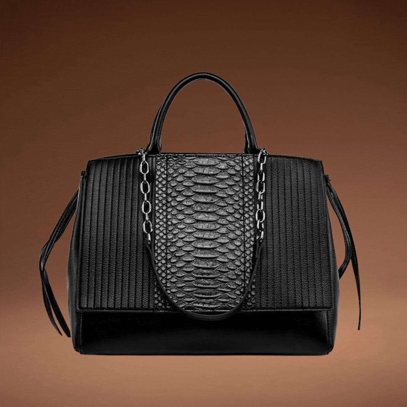 A stunning black and faux snakeskin bag made by Kenzina