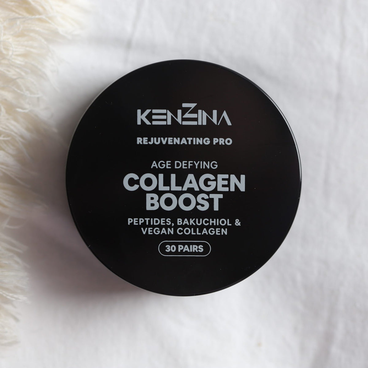 Collagen Boost jar on a soft knit throw
